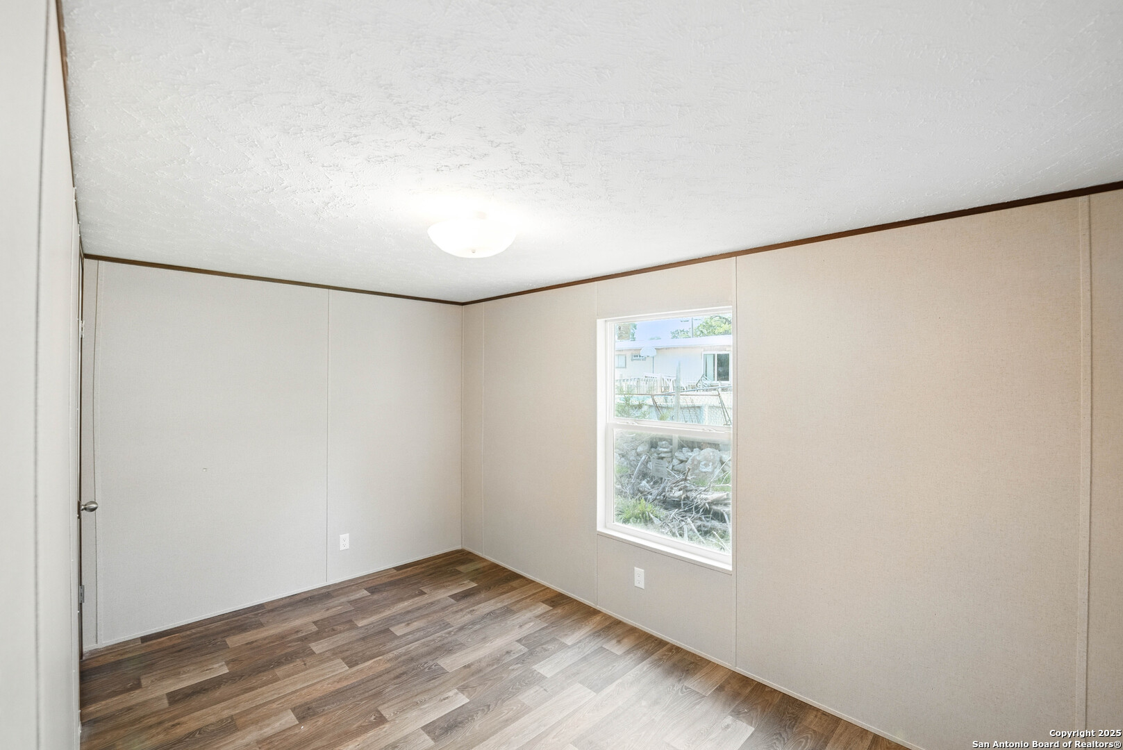 938 Covered Wagon Spring Branch, TX 78070 - Photo 16 of 20 a view of an empty room with a window