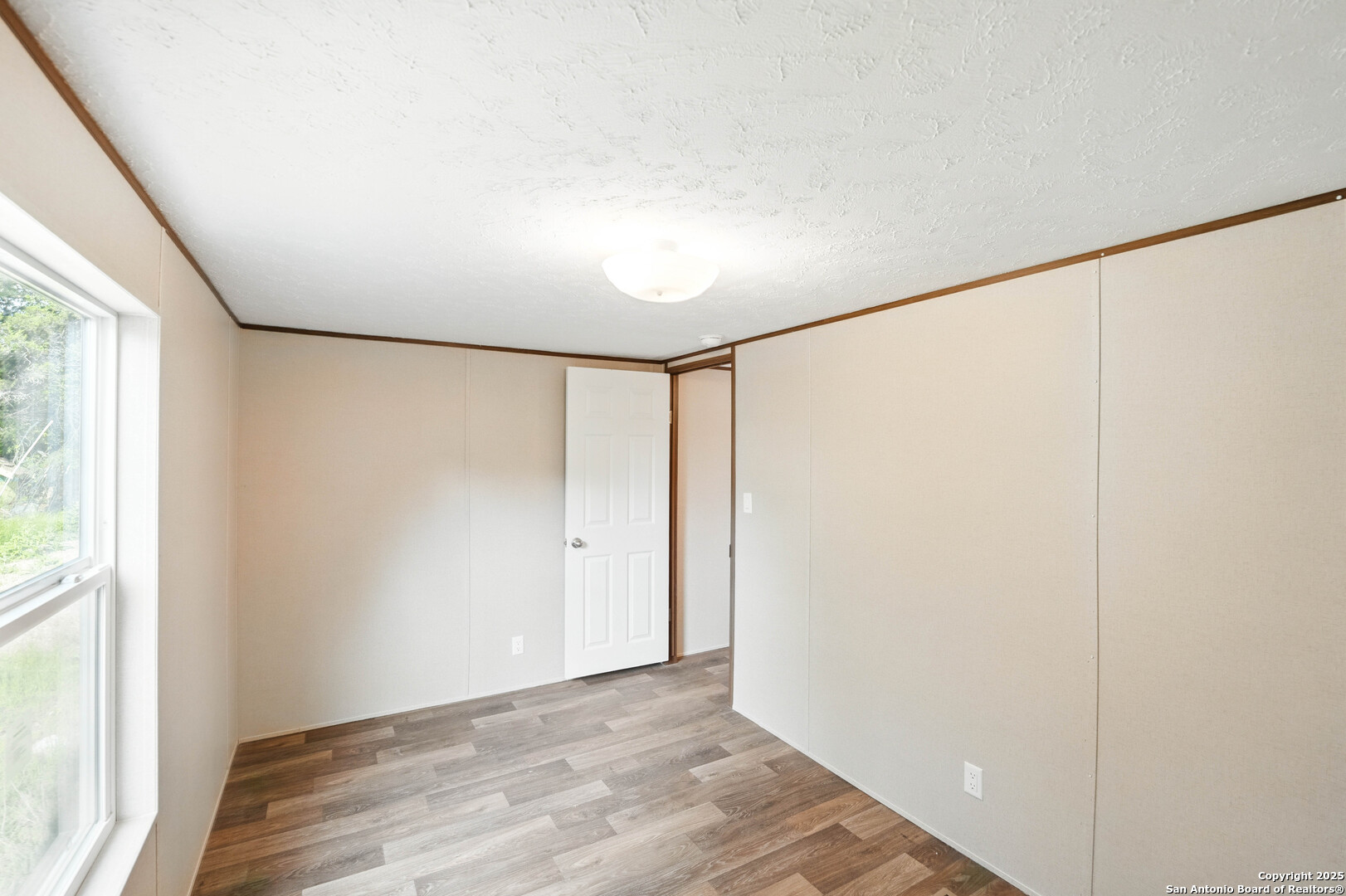938 Covered Wagon Spring Branch, TX 78070 - Photo 17 of 20 a view of an empty room with a window
