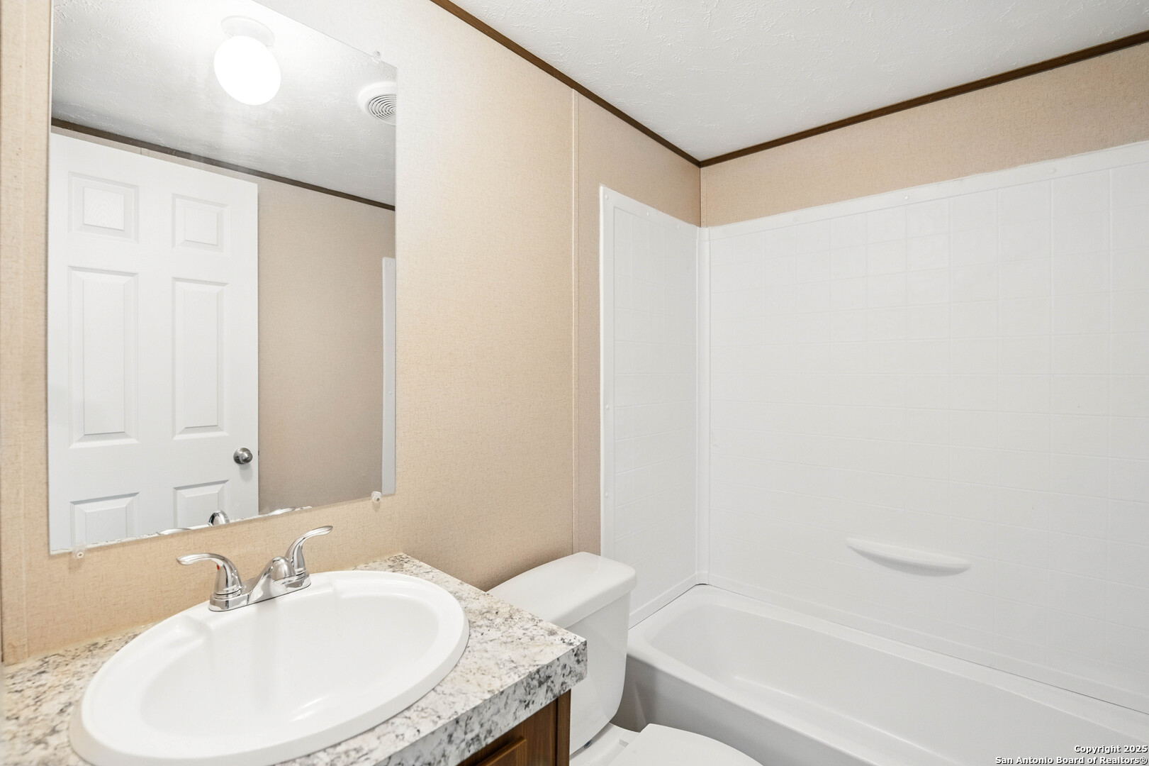 938 Covered Wagon Spring Branch, TX 78070 - Photo 18 of 20 a bathroom with a sink and a mirror