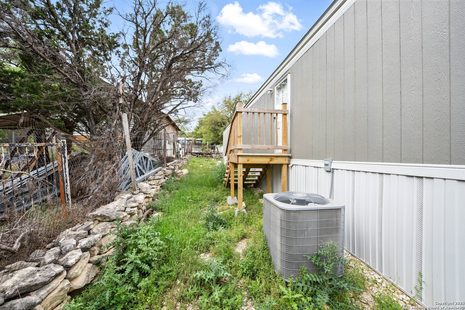 938 Covered Wagon Spring Branch, TX 78070 - Photo 20 of 20 a view of a balcony with chairs and a potted plant