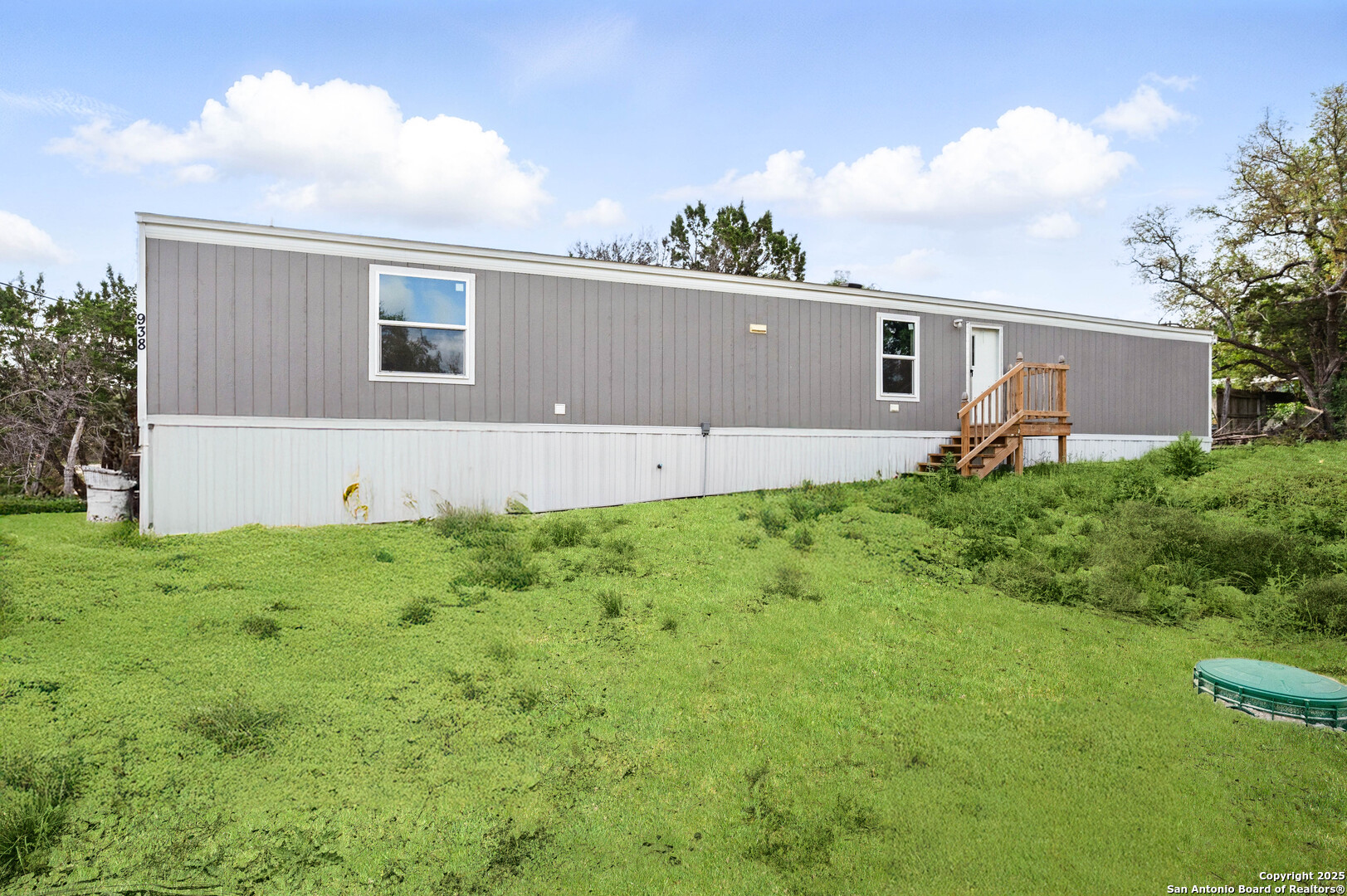 938 Covered Wagon Spring Branch, TX 78070 - Photo 2 of 20 a house view with a garden space