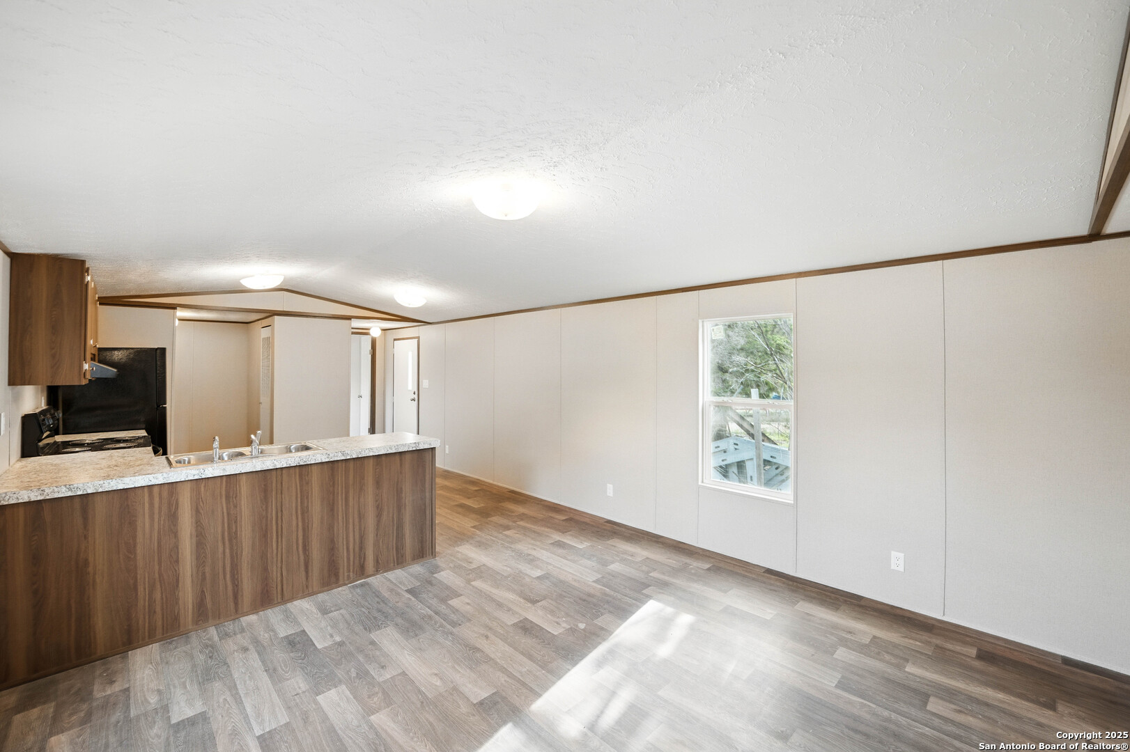 938 Covered Wagon Spring Branch, TX 78070 - Photo 7 of 20 a view of a hallway with wooden floor and staircase