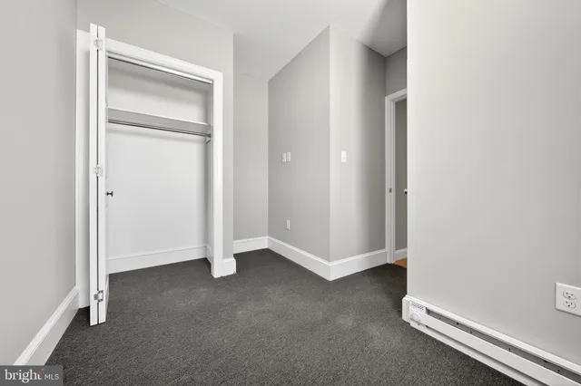 an empty room with closet