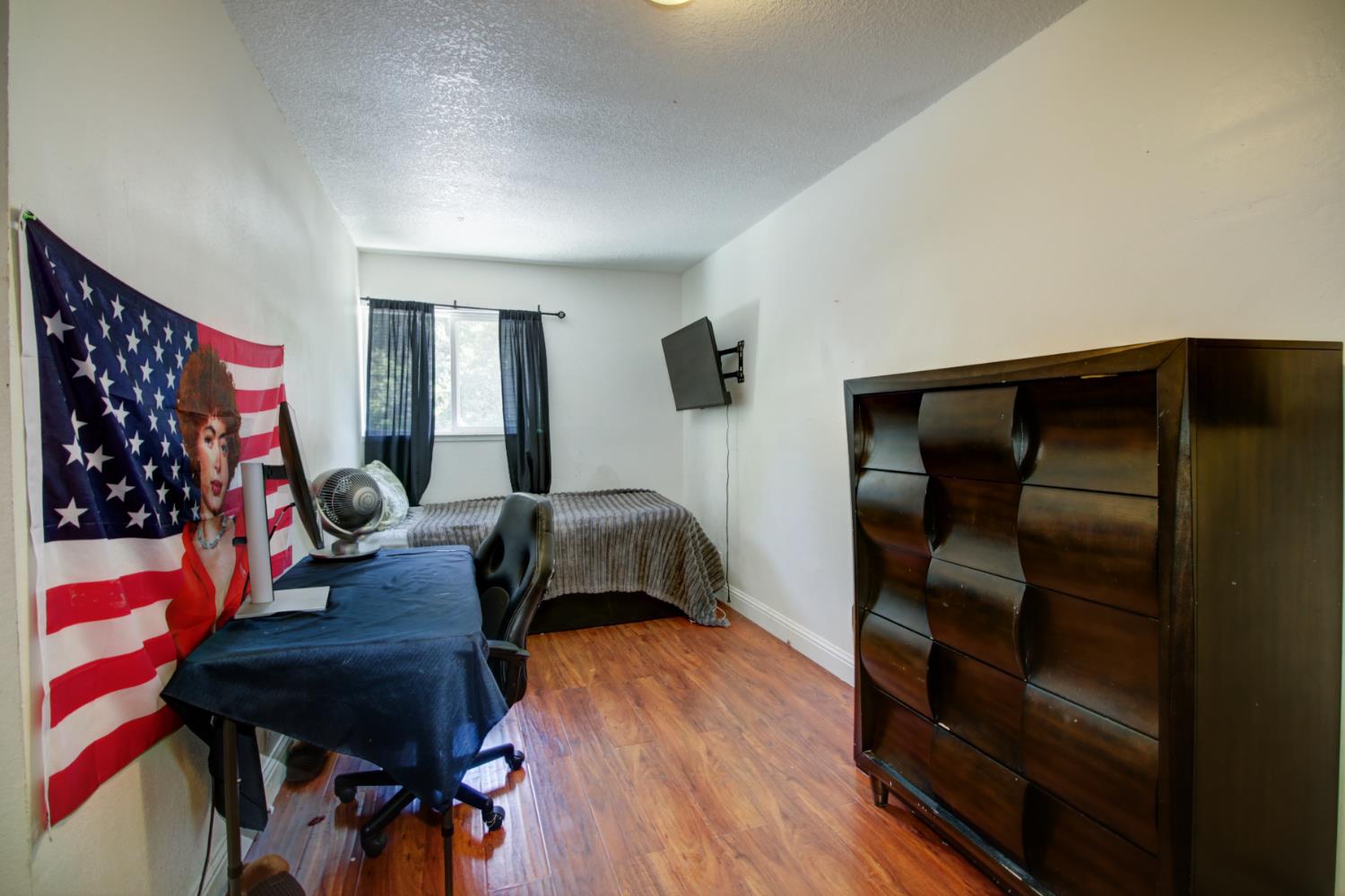 6114 Shadow Lane Citrus Heights, CA 95621 - Photo 11 of 56 a bedroom with a bed and a mirror