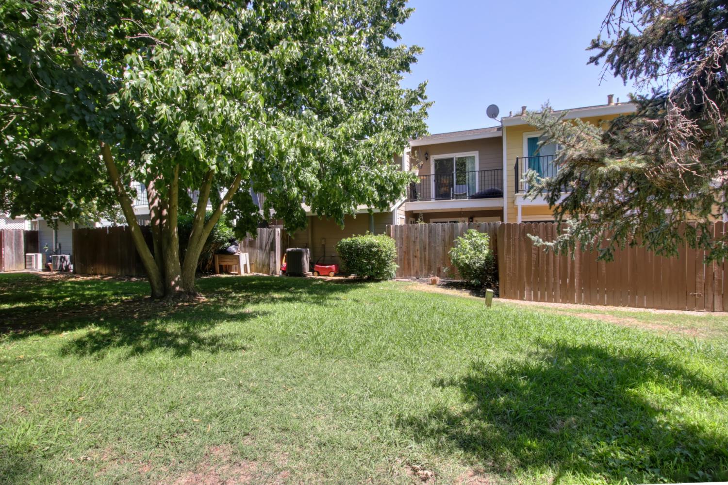 6114 Shadow Lane Citrus Heights, CA 95621 - Photo 22 of 56 a view of a yard in front of a house with large tree