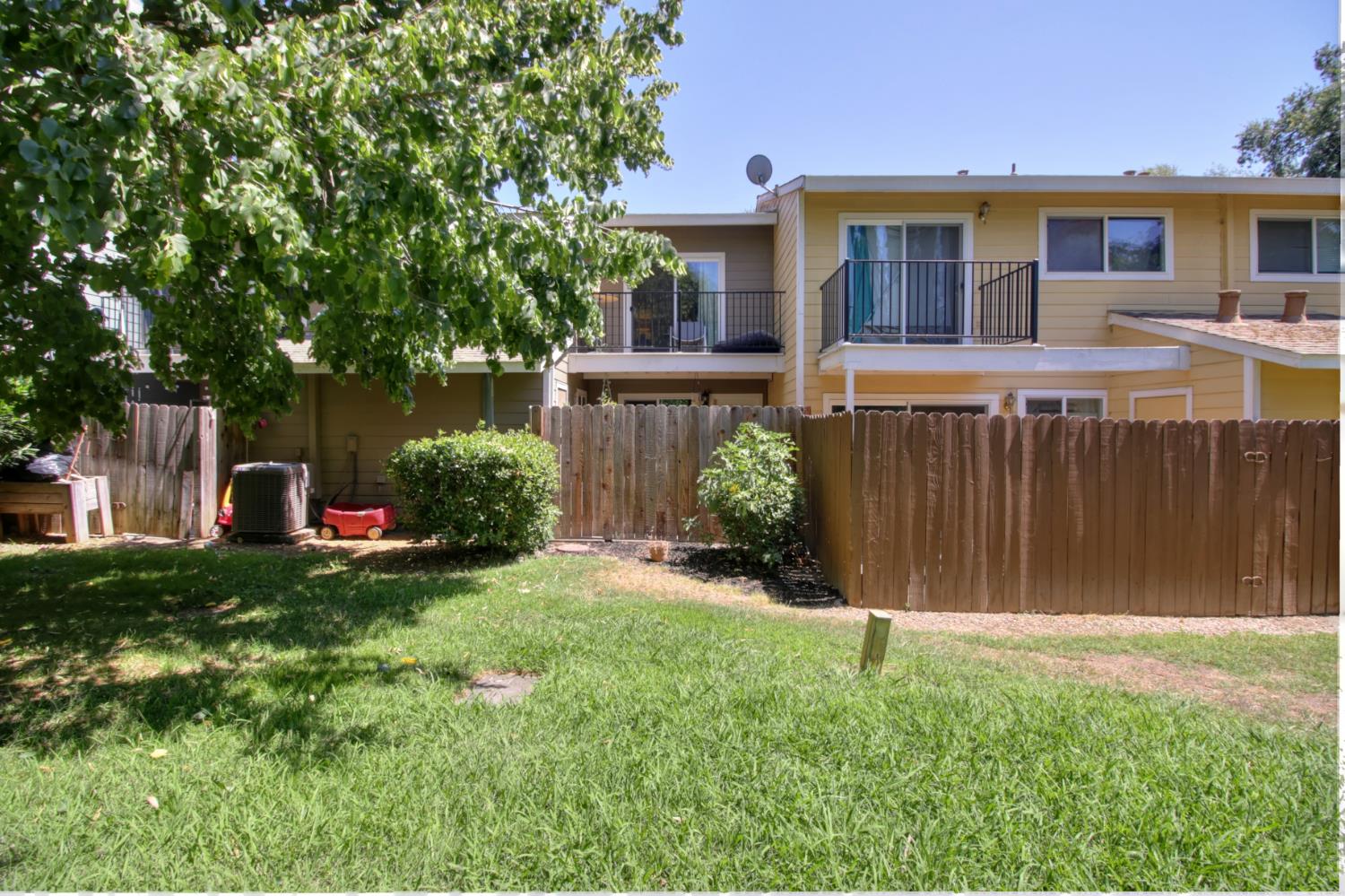 6114 Shadow Lane Citrus Heights, CA 95621 - Photo 23 of 56 a view of a house with a yard and a large tree