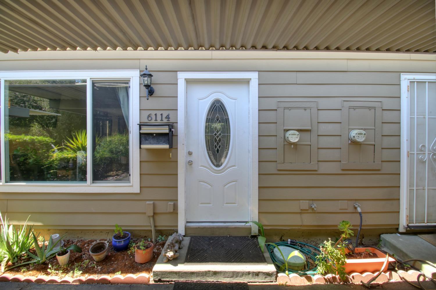 6114 Shadow Lane Citrus Heights, CA 95621 - Photo 3 of 56 a front view of a house with garden