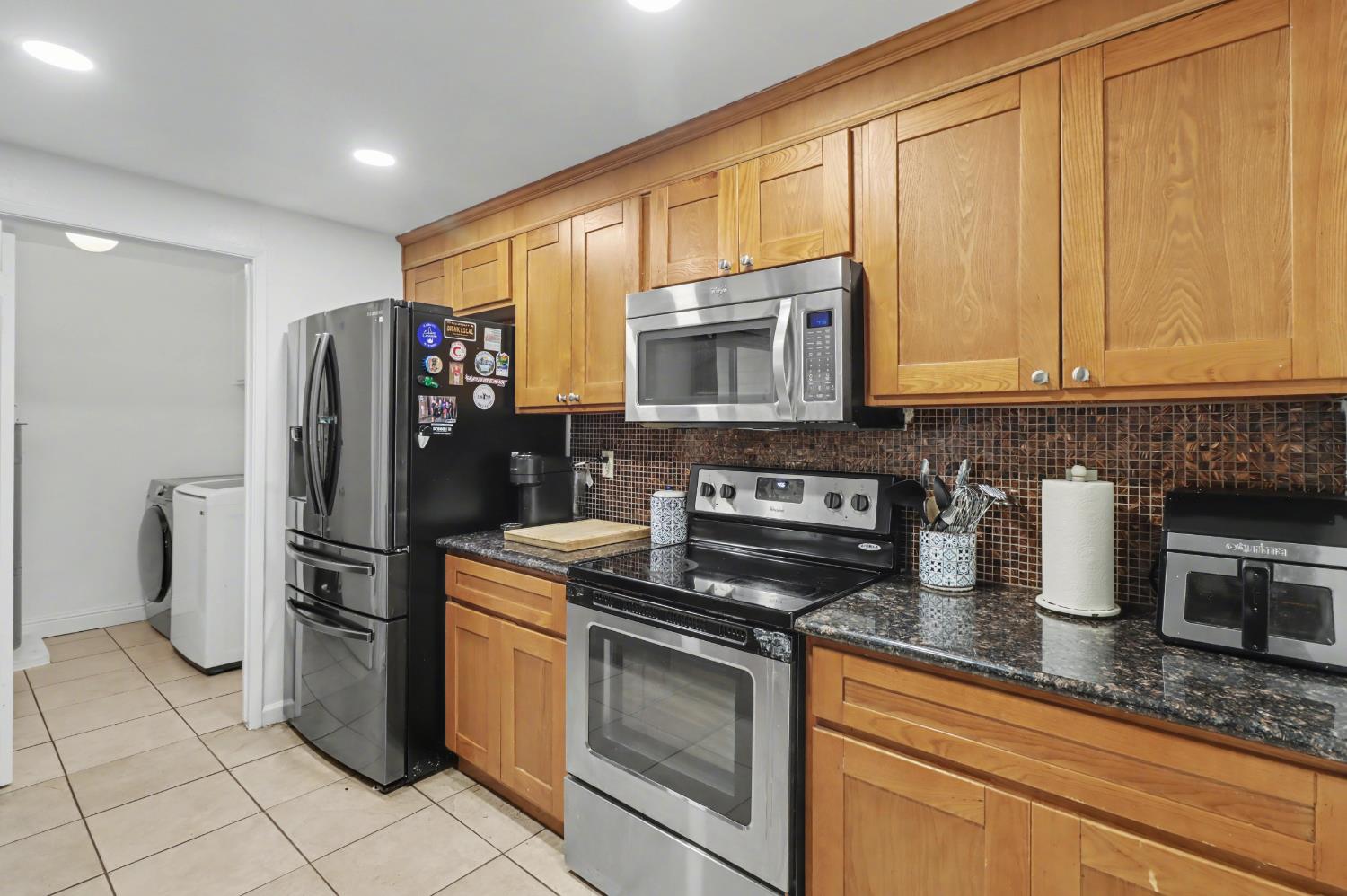 6114 Shadow Lane Citrus Heights, CA 95621 - Photo 42 of 56 a kitchen with stainless steel appliances granite countertop a refrigerator stove and sink
