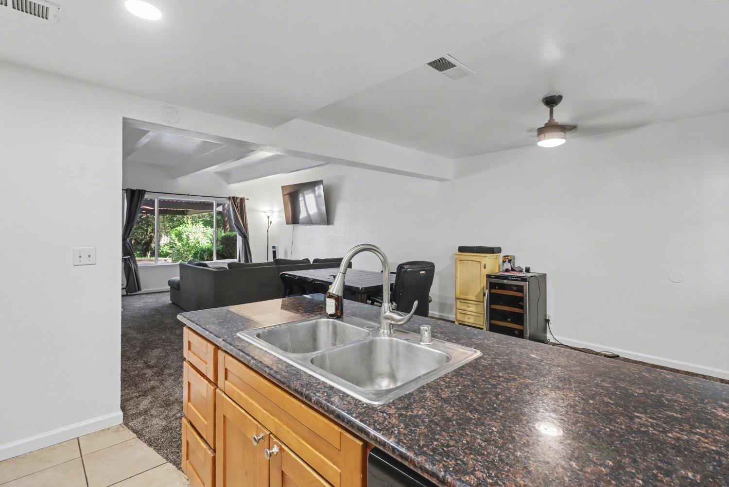 6114 Shadow Lane Citrus Heights, CA 95621 - Photo 45 of 56 a kitchen with granite countertop a sink a stove and a microwave oven