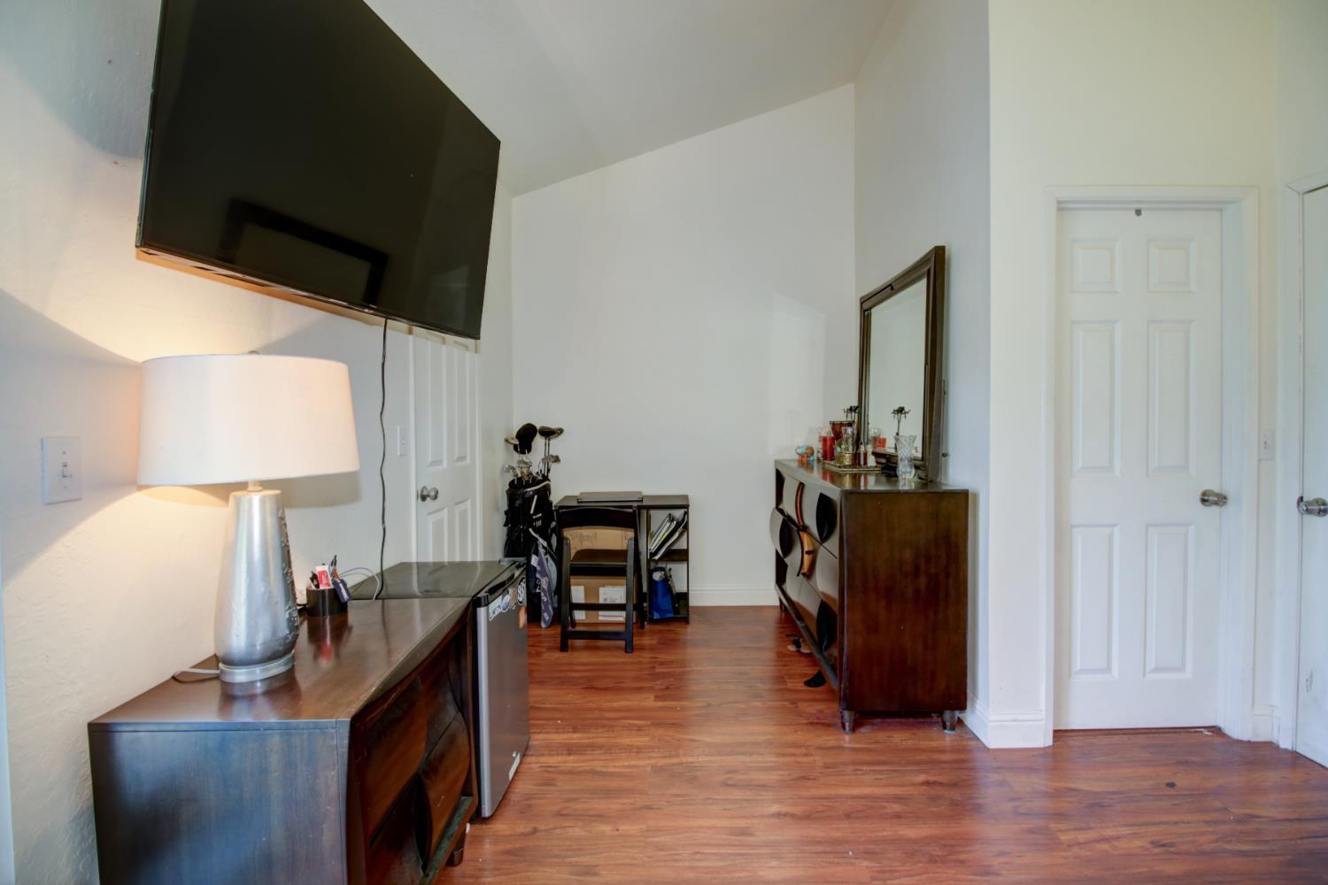 6114 Shadow Lane Citrus Heights, CA 95621 - Photo 6 of 56 a view of a workspace with furniture and a flat screen tv