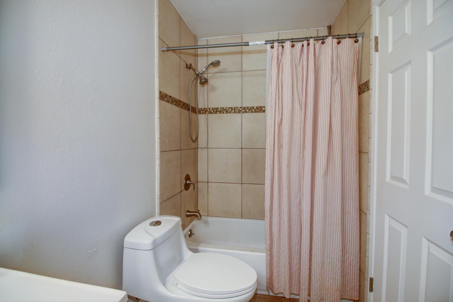 6114 Shadow Lane Citrus Heights, CA 95621 - Photo 8 of 56 a white toilet sitting next to a bathroom sink