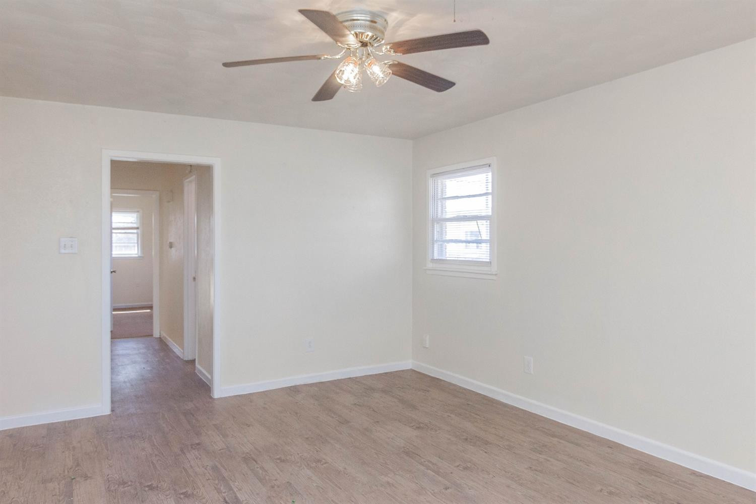 3221 33rd Street, Unit A Lubbock, TX 79410 - Photo 2 of 11 an empty room that has a window in it