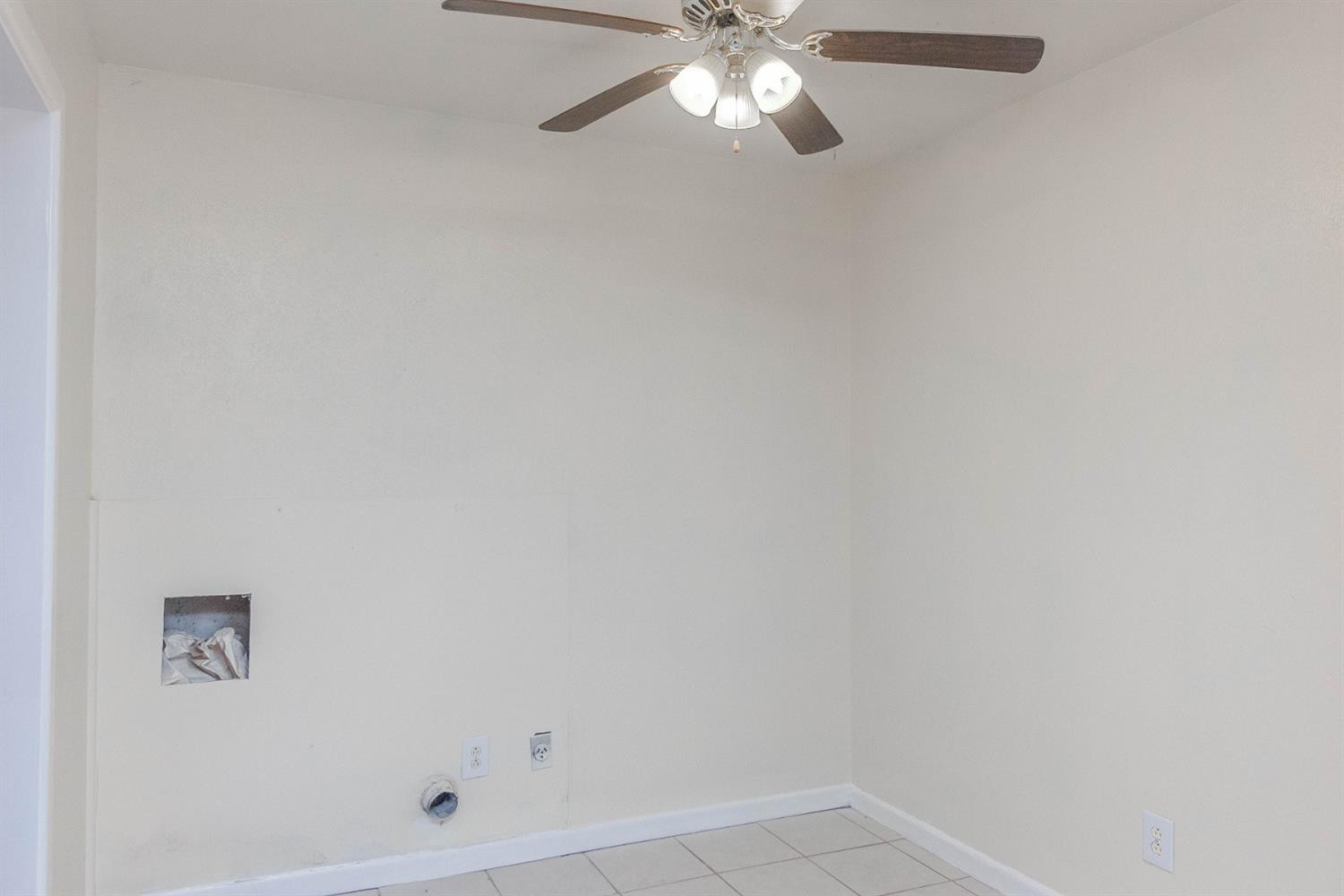 3221 33rd Street, Unit A Lubbock, TX 79410 - Photo 5 of 11 a bathroom with a shower