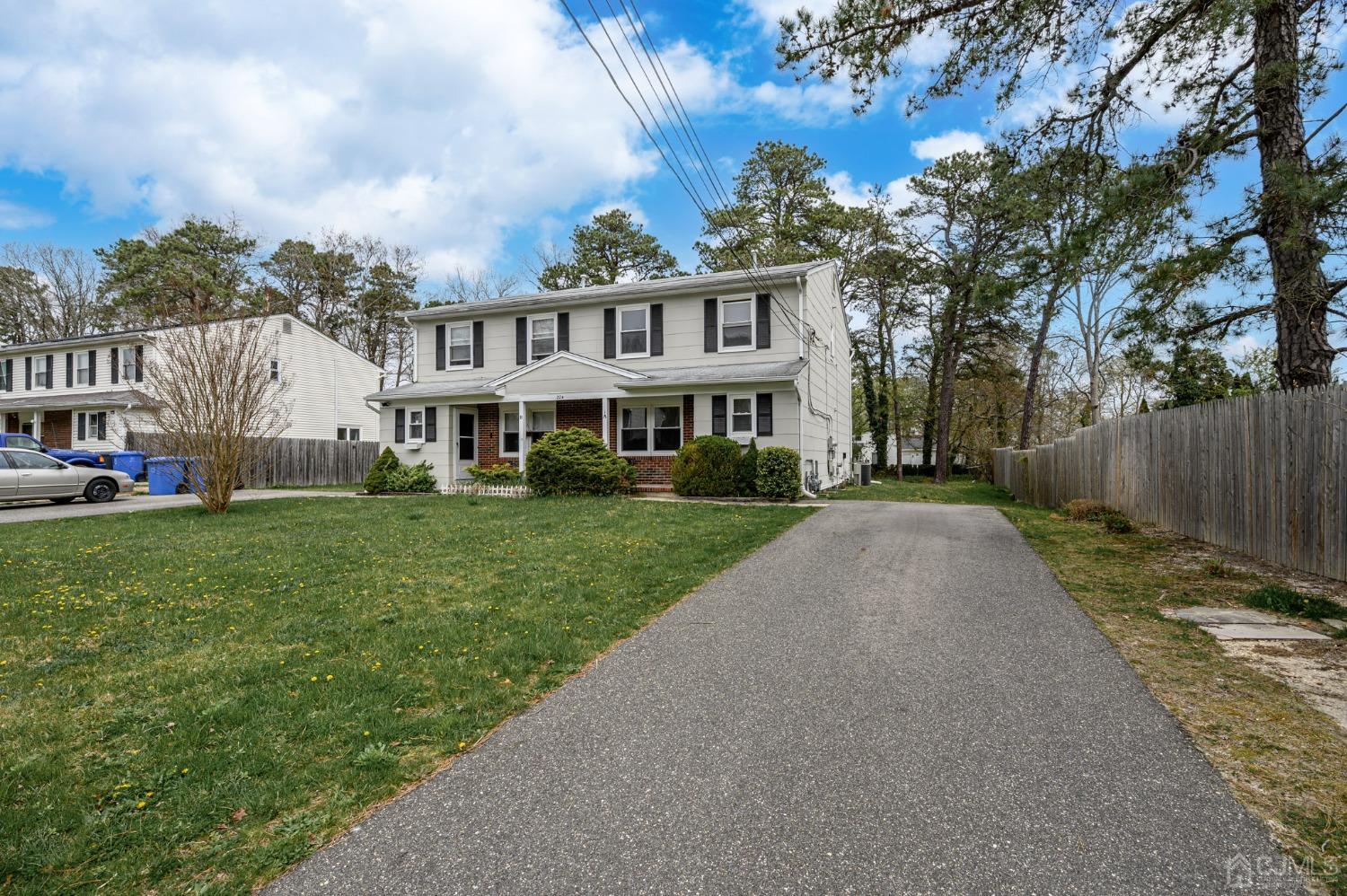 224 Leeward Road Manahawkin, NJ 08050 - Photo 54 of 54 a view of house with a big yard and large trees