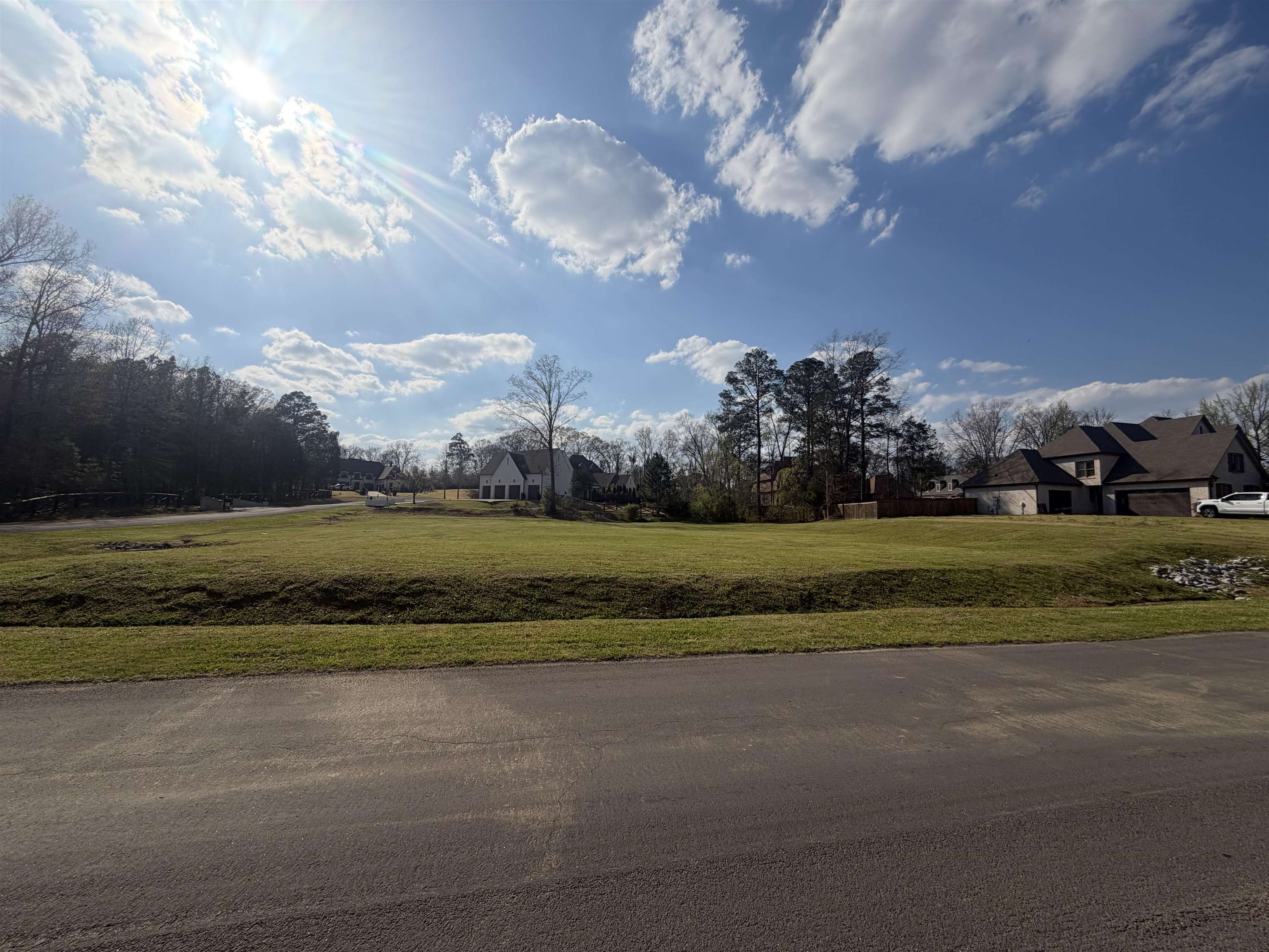 290 Ridgewood Drive Piperton, TN 38017 - Photo 2 of 7 a view of a golf course with a lake