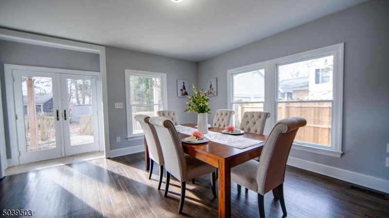 11 Hendrickson Road Lawrence Township, NJ 08648 - Photo 13 of 24 a view of a dining room with furniture and wooden floor