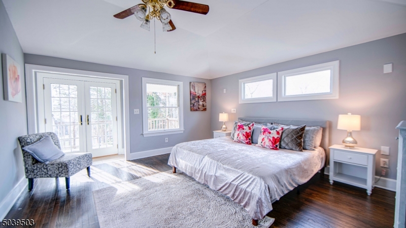 11 Hendrickson Road Lawrence Township, NJ 08648 - Photo 24 of 24 a bedroom with a bed and a chandelier