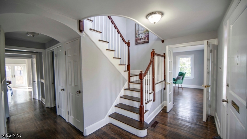 11 Hendrickson Road Lawrence Township, NJ 08648 - Photo 8 of 24 a view of entryway with wooden floor and stairs