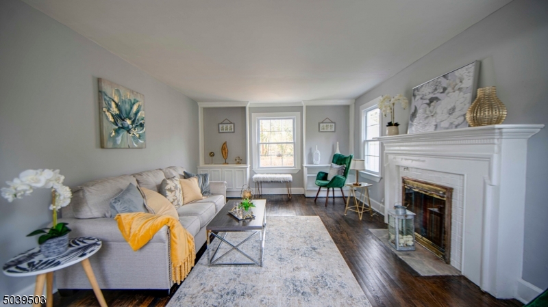 11 Hendrickson Road Lawrence Township, NJ 08648 - Photo 10 of 24 a living room with furniture and a fireplace