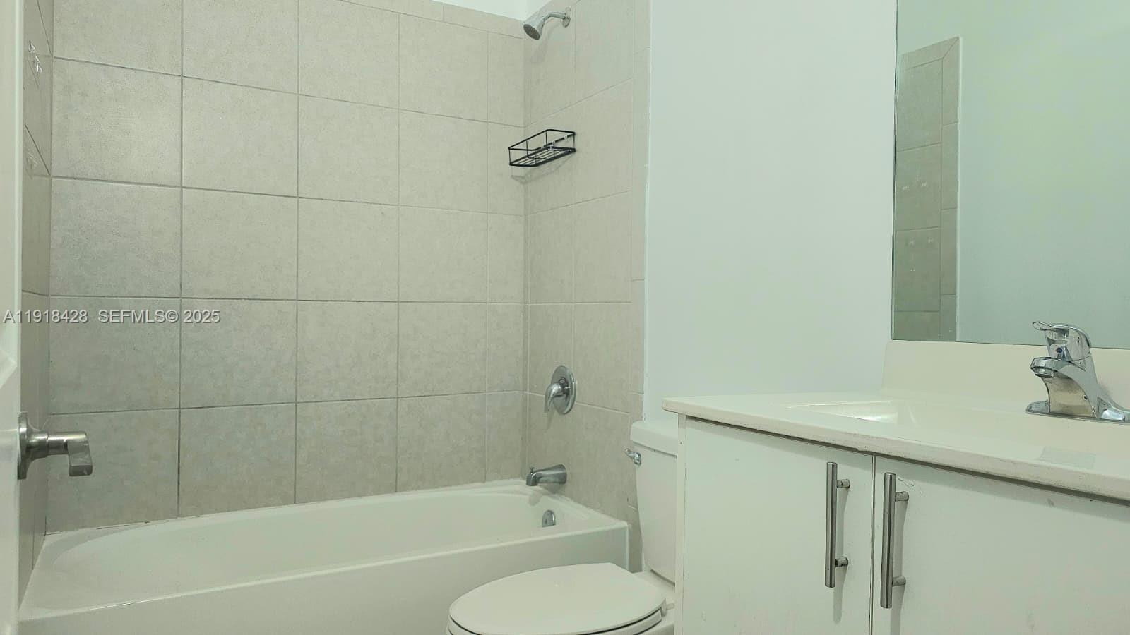 11774 Southwest 246th Street Homestead, FL 33032 - Photo 13 of 18 a bathroom with a sink a toilet and shower