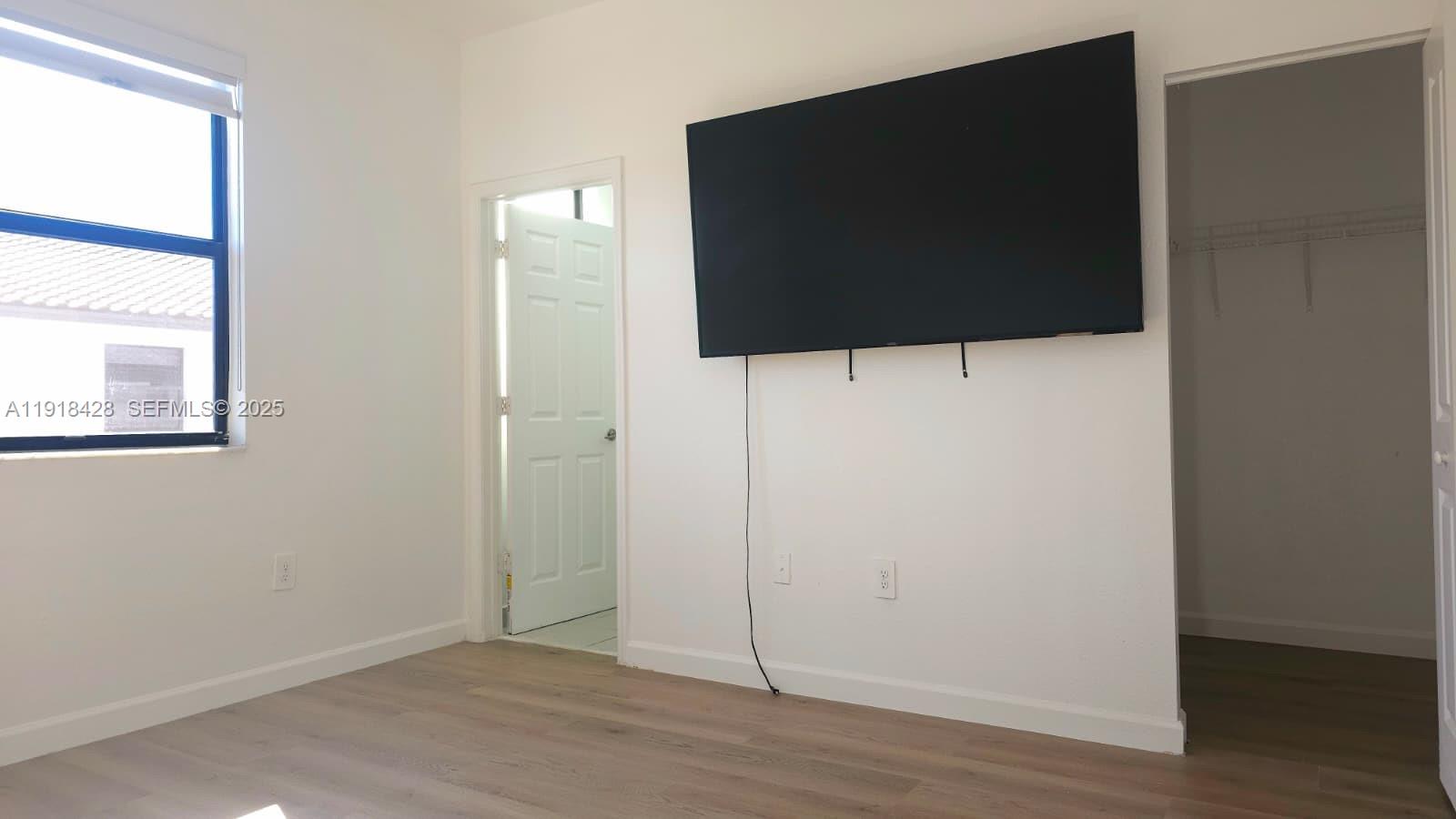 11774 Southwest 246th Street Homestead, FL 33032 - Photo 7 of 18 a view of a livingroom with wooden floor