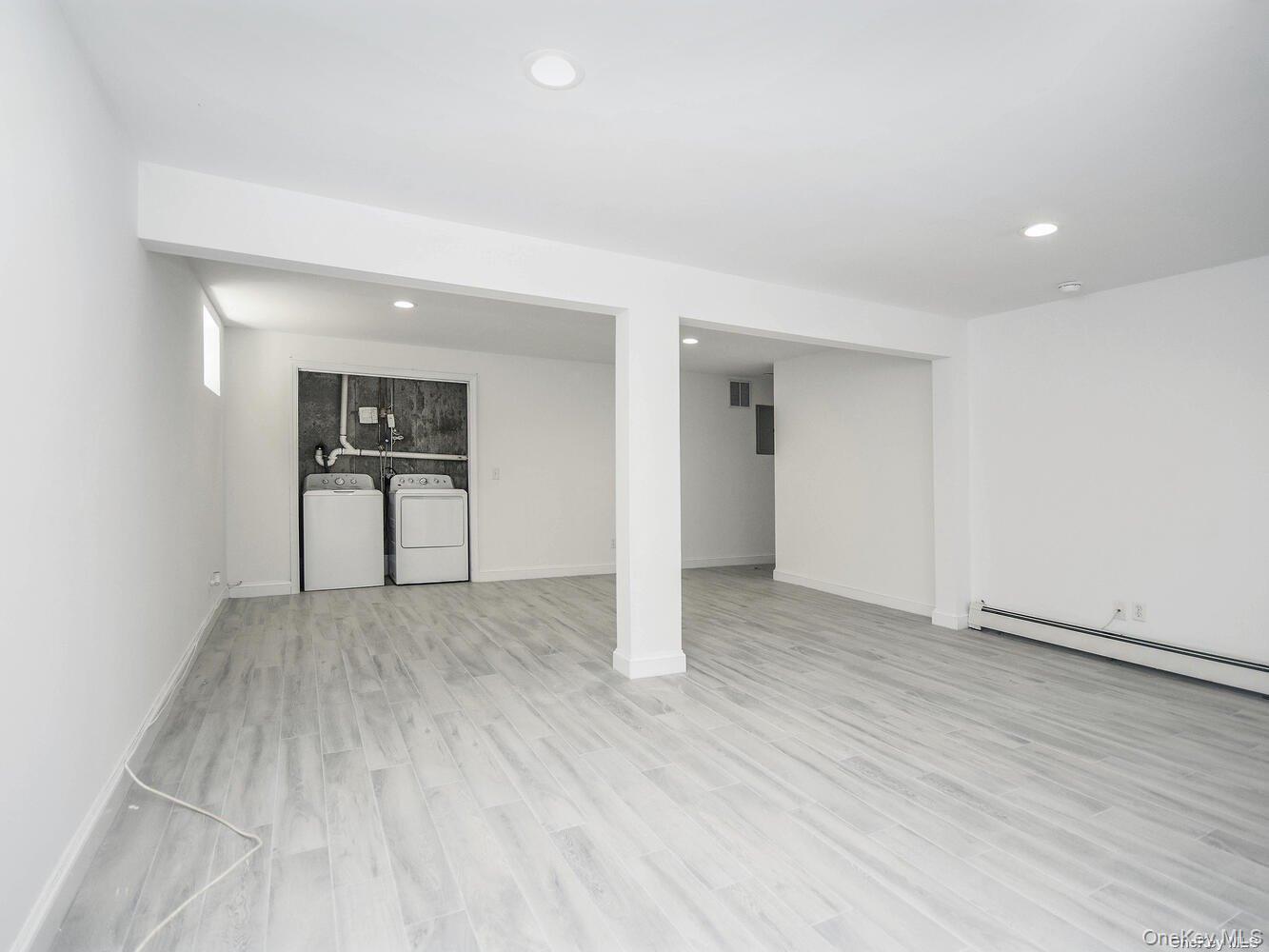 34 Firwood Road, Unit B Port Washington, NY 11050 - Photo 19 of 25 an empty room with closet and a window
