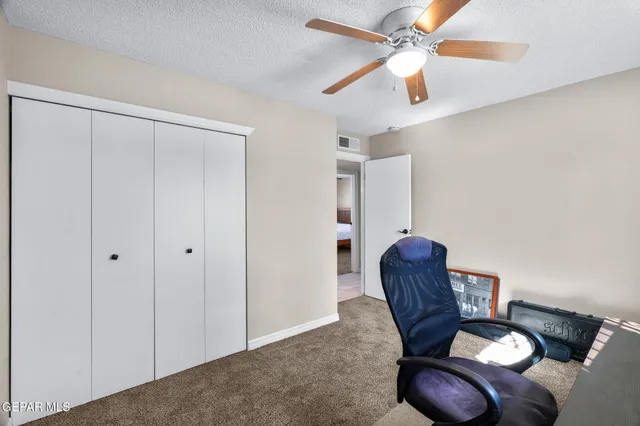 a view of livingroom with furniture and a ceiling fan