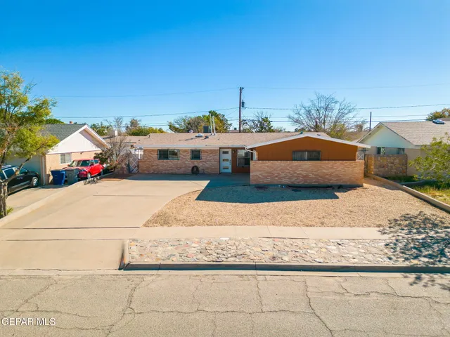 a balcony with furniture and a table