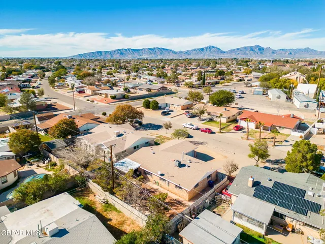 an aerial view of residential building and ocean