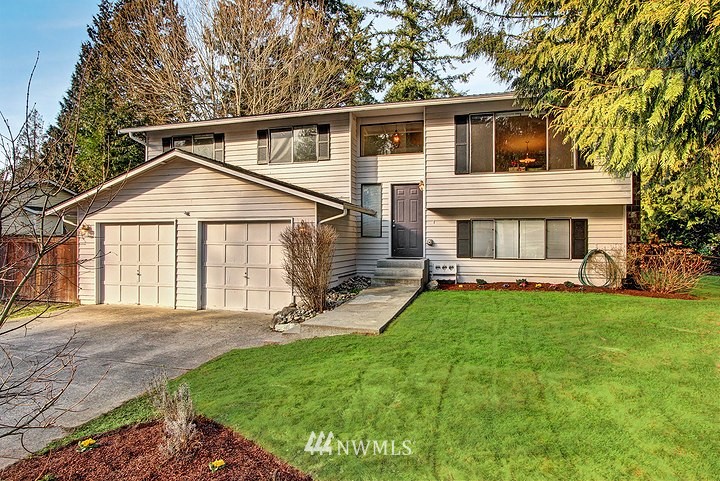 2905 165th Place Southeast Bothell, WA 98012 - Photo 1 of 18 a front view of a house with a yard and porch