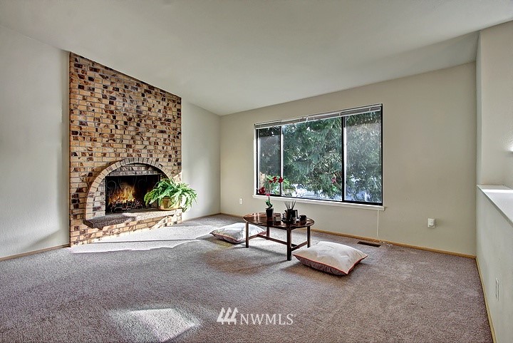 2905 165th Place Southeast Bothell, WA 98012 - Photo 2 of 18 a living room with furniture and a fireplace