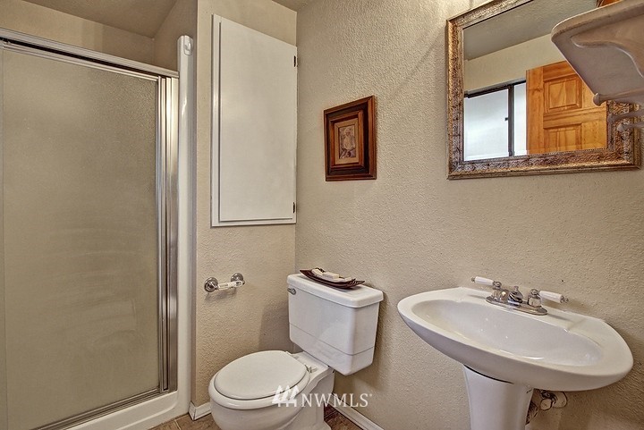 2905 165th Place Southeast Bothell, WA 98012 - Photo 11 of 18 a bathroom with a sink toilet and a mirror