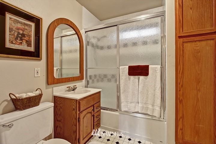 2905 165th Place Southeast Bothell, WA 98012 - Photo 15 of 18 a bathroom with a sink and a mirror