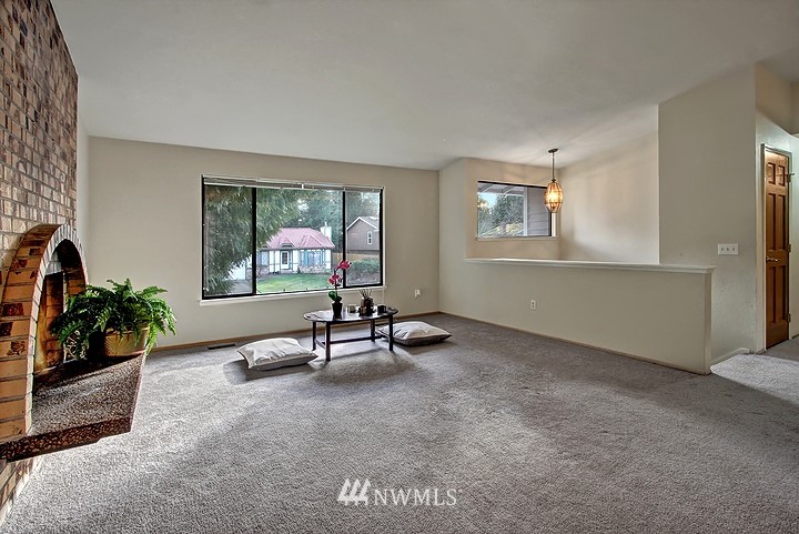 2905 165th Place Southeast Bothell, WA 98012 - Photo 3 of 18 a living room with furniture and a window