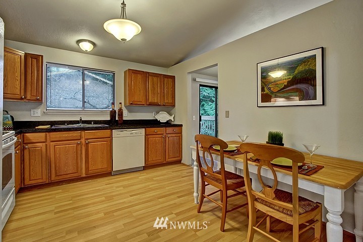 2905 165th Place Southeast Bothell, WA 98012 - Photo 5 of 18 a view of a kitchen counter space and wooden floor