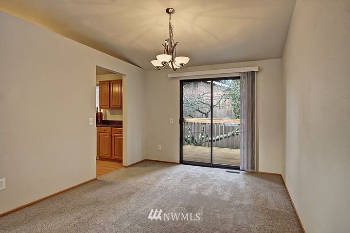 2905 165th Place Southeast Bothell, WA 98012 - Photo 6 of 18 a view of a livingroom with a chandelier fan and windows