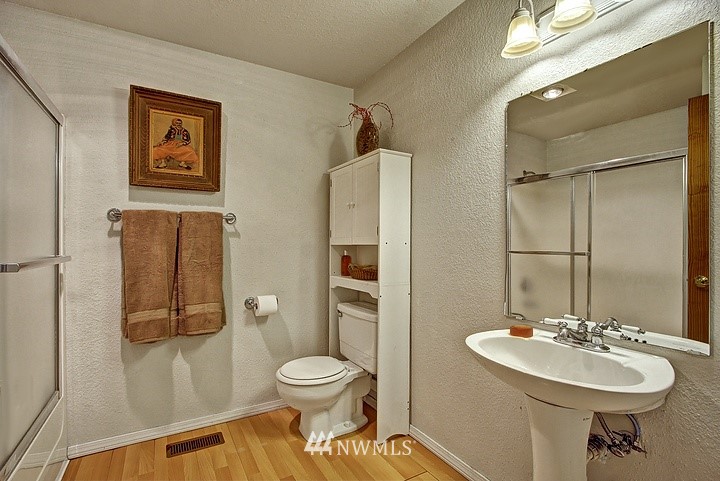 2905 165th Place Southeast Bothell, WA 98012 - Photo 7 of 18 a bathroom with a toilet sink and shower
