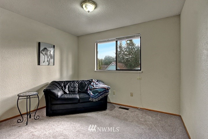 2905 165th Place Southeast Bothell, WA 98012 - Photo 8 of 18 a living room with furniture and a window