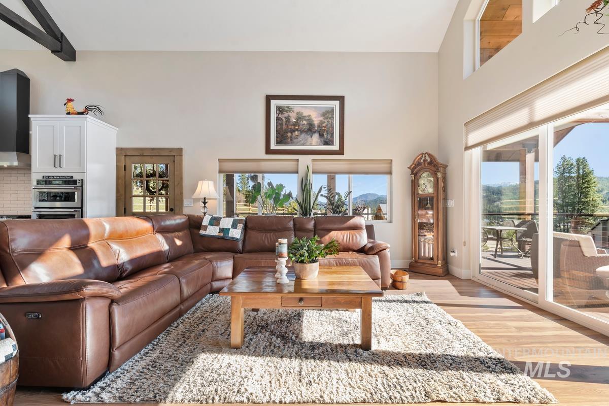 21 Open Road Garden Valley, ID 83622 - Photo 4 of 49 Living room featuring a high ceiling and light wood-type flooring