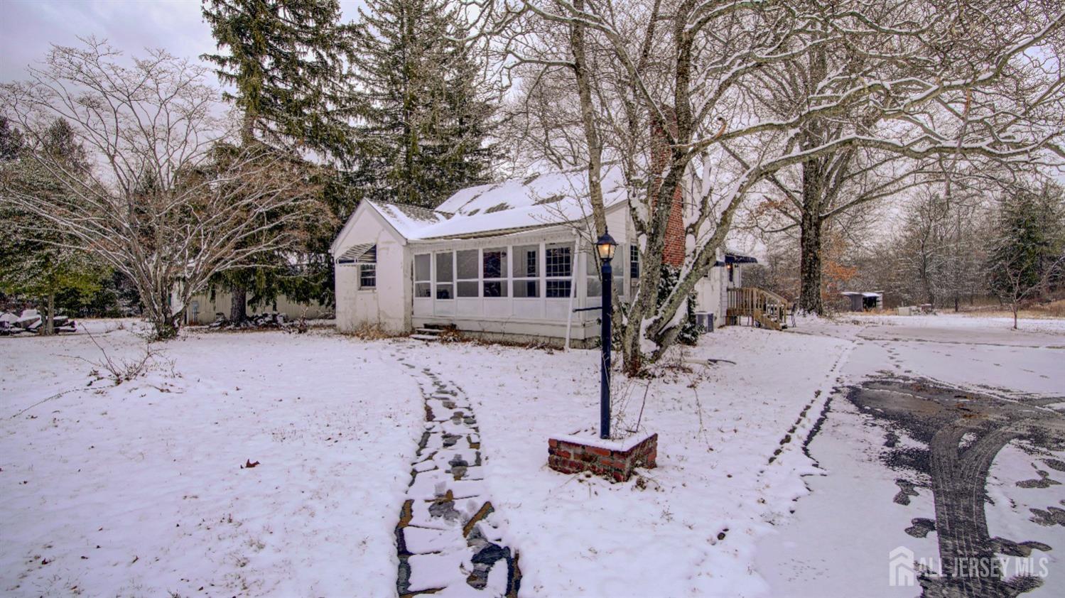 24 Copper Mine Road Princeton, NJ 08540 - Photo 1 of 1 a front view of a house with a yard covered in snow