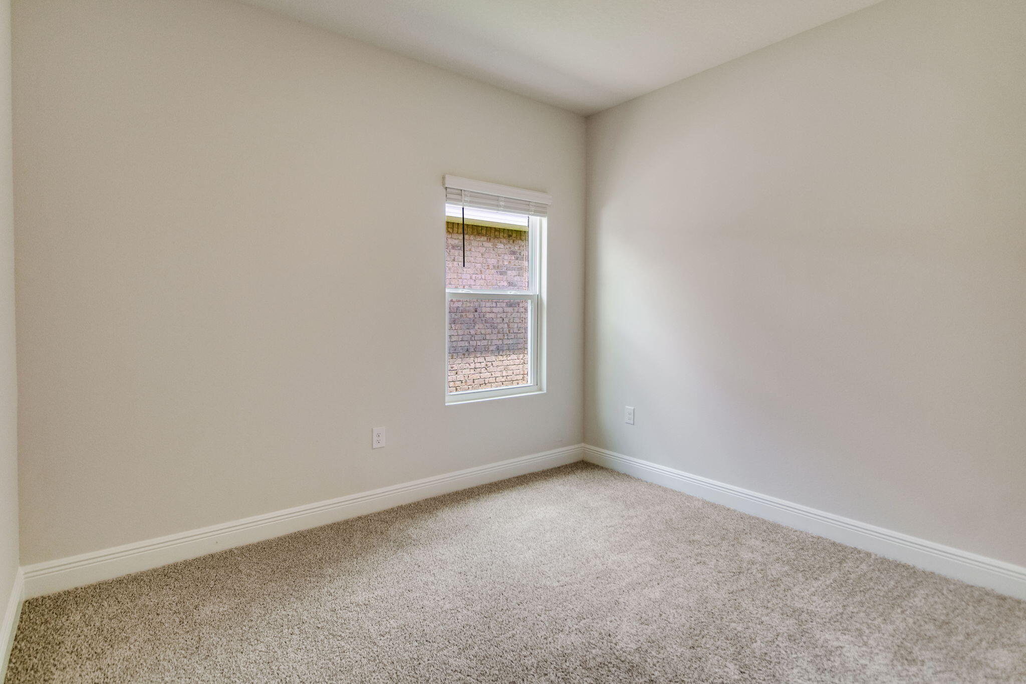 8676 Bluebell Street Milton, FL 32583 - Photo 30 of 32 an empty room with a window