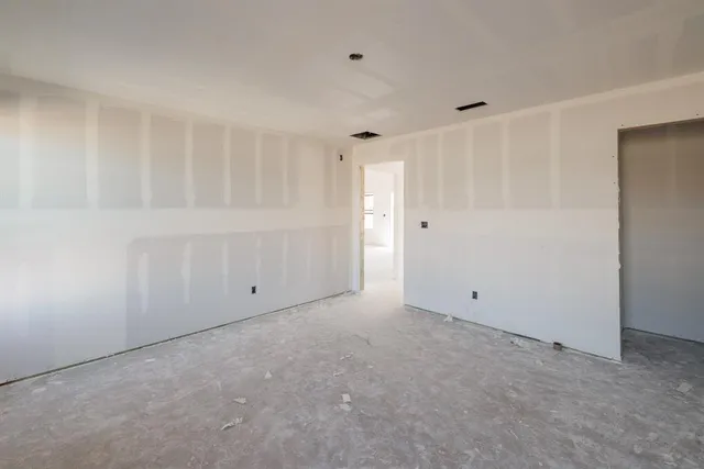 an empty room with windows