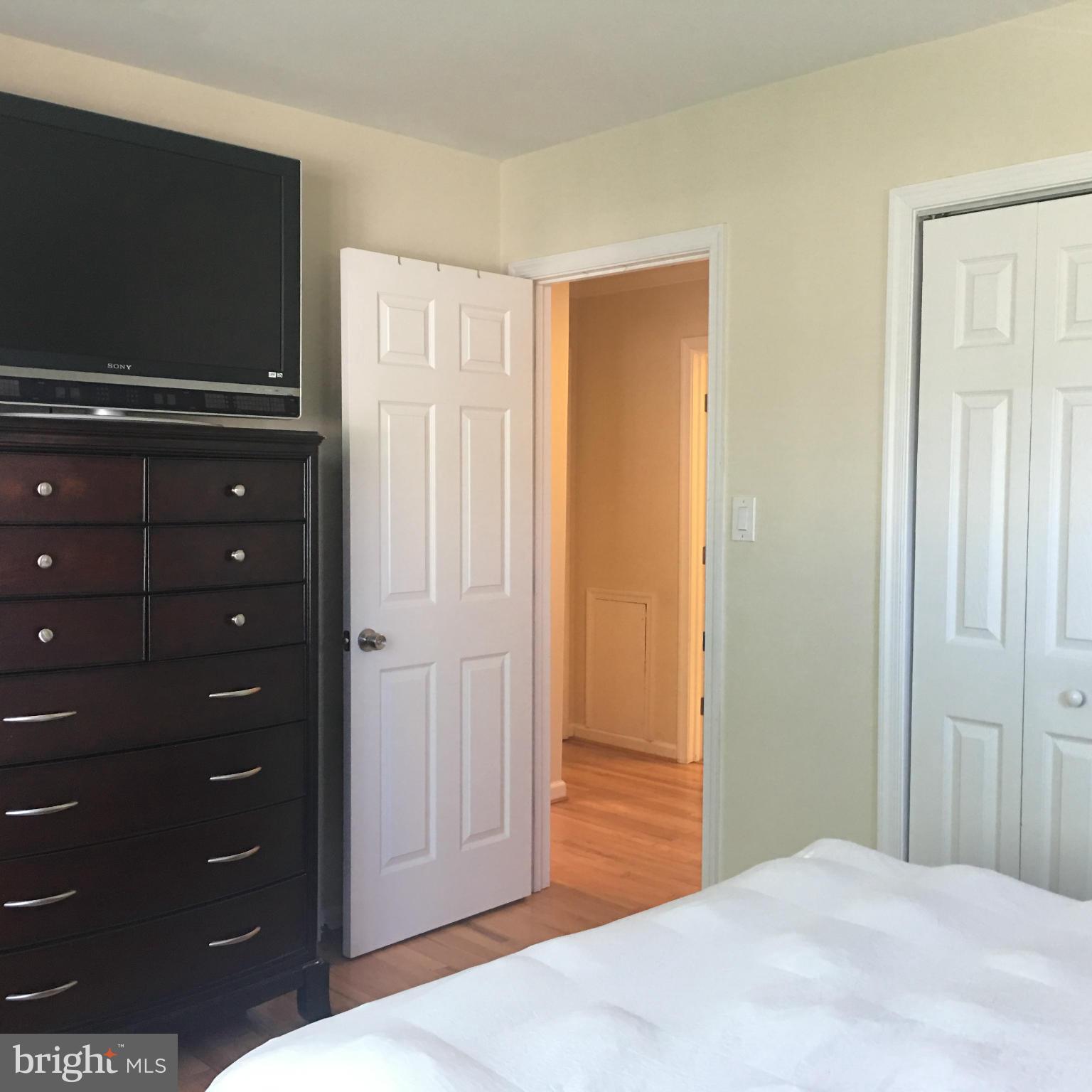 13306 Lydia Street Silver Spring, MD 20906 - Photo 11 of 30 a bedroom with a bed and a television