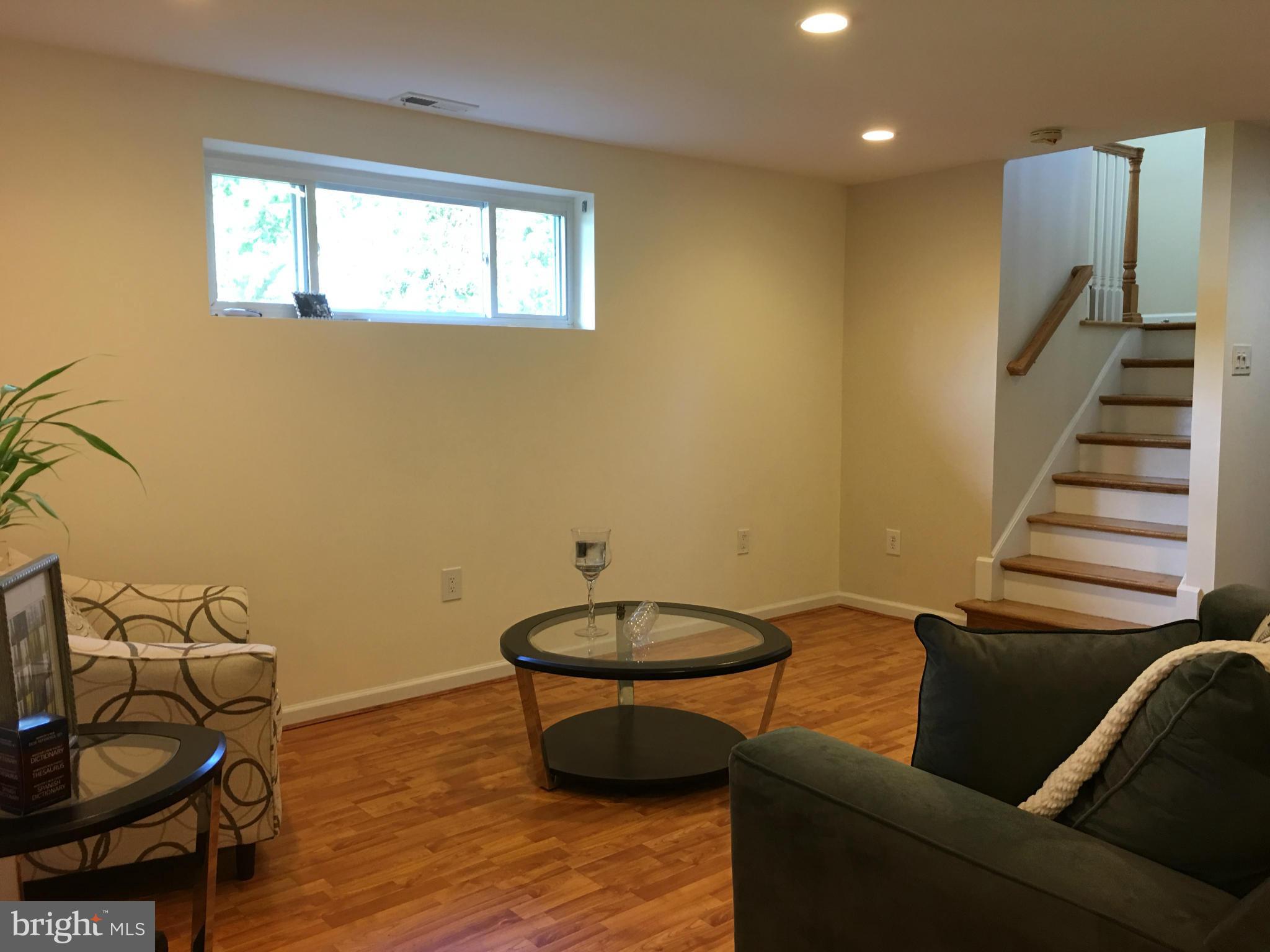 13306 Lydia Street Silver Spring, MD 20906 - Photo 20 of 30 a living room with furniture and a window