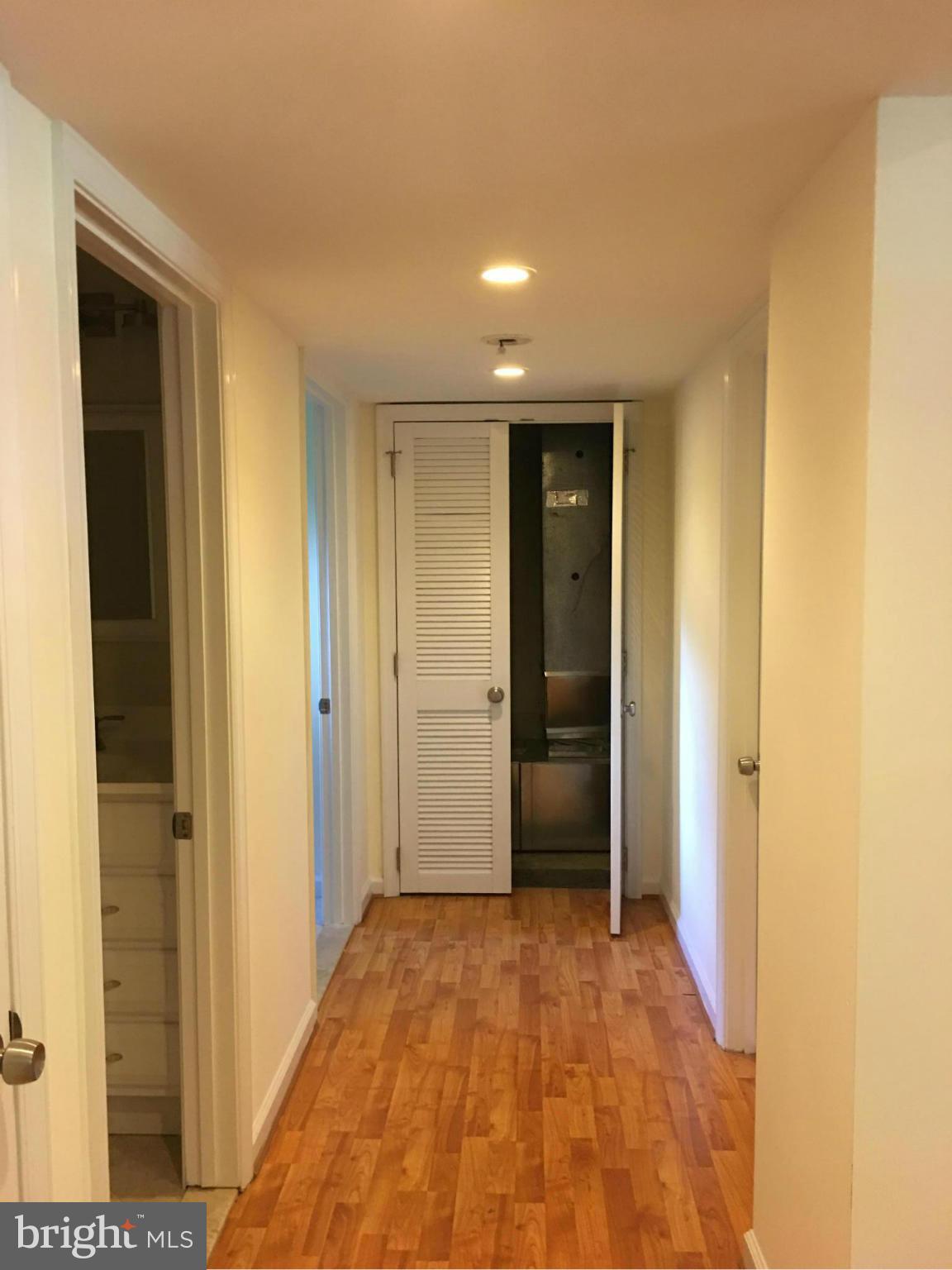 13306 Lydia Street Silver Spring, MD 20906 - Photo 21 of 30 a view of hallway with wooden floor