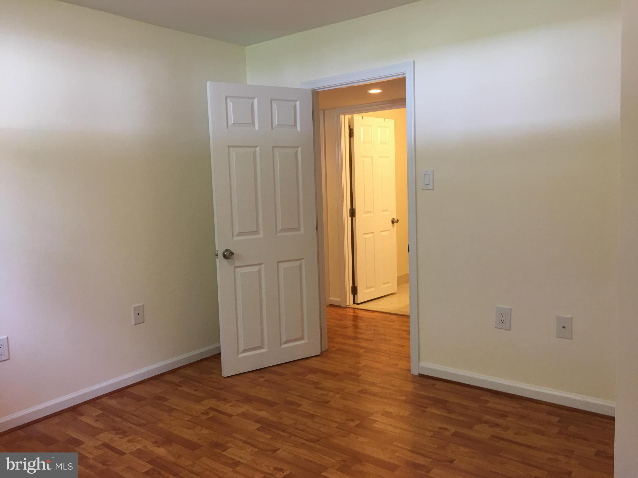 13306 Lydia Street Silver Spring, MD 20906 - Photo 24 of 30 a view of an empty room with wooden floor and closet