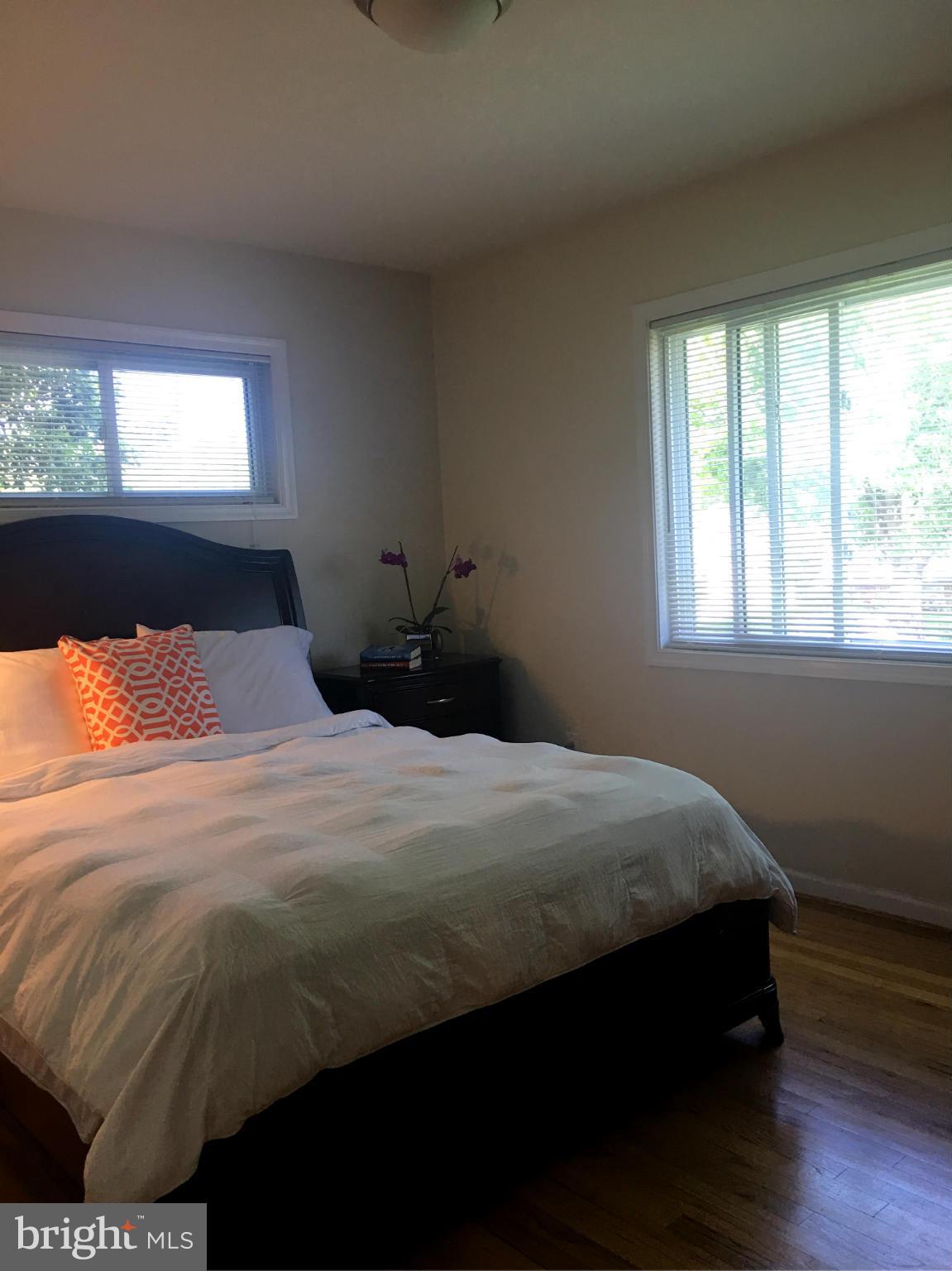 13306 Lydia Street Silver Spring, MD 20906 - Photo 10 of 30 a bedroom with a bed and window