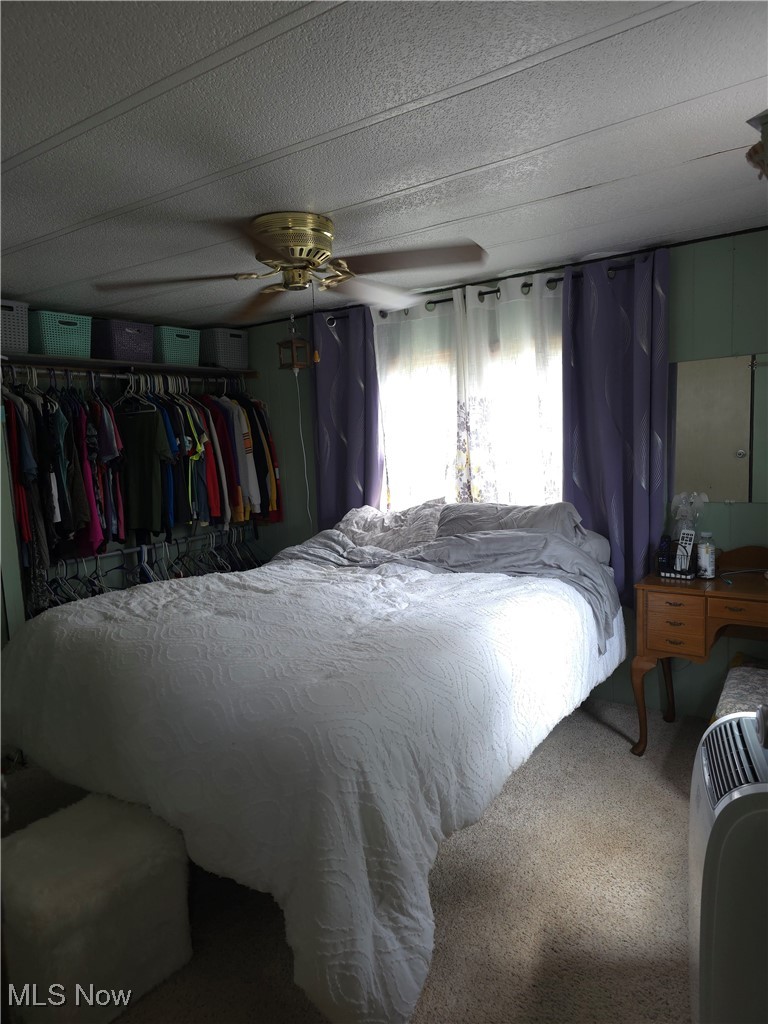 1440 Porter Road Atwater, OH 44201 - Photo 4 of 11 Bedroom featuring carpet and a ceiling fan