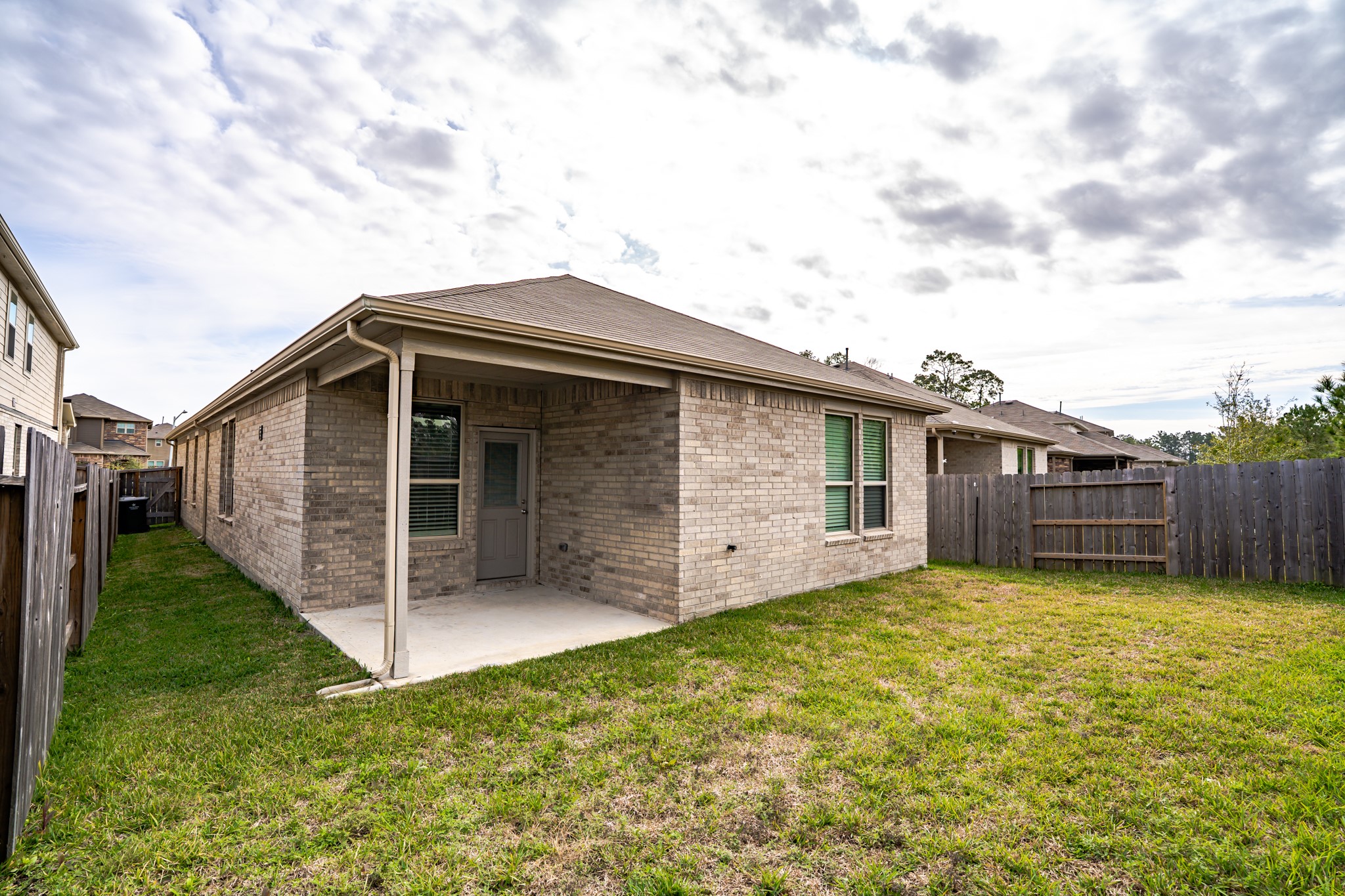 16126 Elbridge Court Conroe, TX 77302 - Photo 12 of 15 a view of a house with a yard