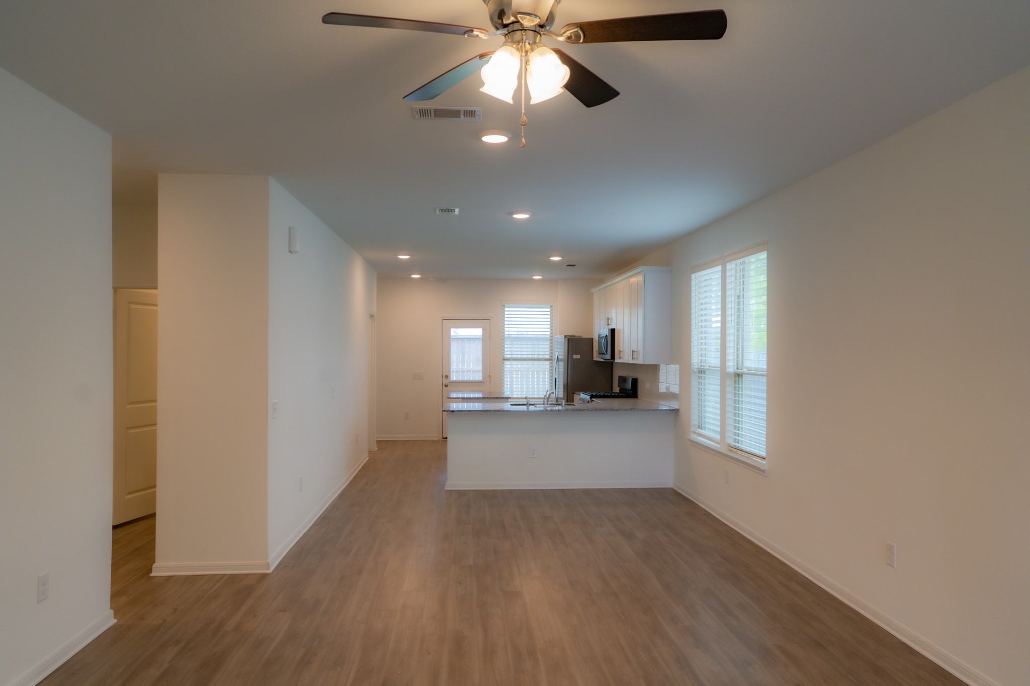 16126 Elbridge Court Conroe, TX 77302 - Photo 2 of 15 a view of a kitchen with a sink and a window